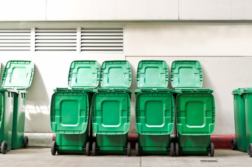 Maintenance technician inspecting waste collection vehicle
